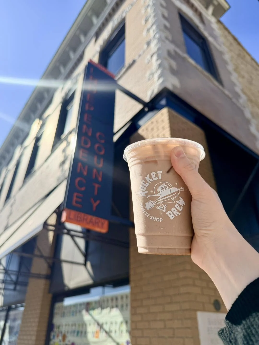 A Rocket Brew iced coffee outside the Independence County Library on Main Street